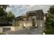 Backyard with an outdoor living area featuring tiered landscaping, stone pathways, accent lighting, and a private balcony at 2523 Ryan Blvd, Punta Gorda, FL 33950