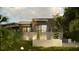 Home rear exterior boasts privacy, lush landscaping, garden, and balcony for outdoor enjoyment at 2523 Ryan Blvd, Punta Gorda, FL 33950