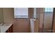 Clean bathroom with a shower and a window at 2585 Yuma Ave, North Port, FL 34286