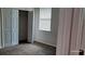 Bedroom featuring carpeted floors, a closet and a window at 2585 Yuma Ave, North Port, FL 34286