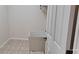 Laundry room featuring tile flooring and a utility sink at 2585 Yuma Ave, North Port, FL 34286