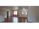 Spacious living room features hardwood floors, a ceiling fan, and a large front entry at 2585 Yuma Ave, North Port, FL 34286