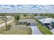 Aerial view of a charming single-Gathering home with well-manicured landscaping and a paved driveway at 26103 Salonika Ln, Punta Gorda, FL 33983