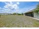Spacious backyard with a screened lanai and plenty of room for outdoor activities at 26103 Salonika Ln, Punta Gorda, FL 33983