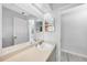 Bright bathroom with vanity, toilet, and large mirror featuring modern fixtures at 26103 Salonika Ln, Punta Gorda, FL 33983