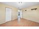 Bedroom with a view of the outdoor space, laminate floors, and neutral walls at 26103 Salonika Ln, Punta Gorda, FL 33983