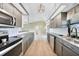 Stylish kitchen boasts modern appliances, sleek countertops and abundant cabinet space, seamlessly connecting to the living area at 26103 Salonika Ln, Punta Gorda, FL 33983