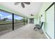 Comfortable screened-in lanai with open views of the spacious backyard and lovely green space at 26103 Salonika Ln, Punta Gorda, FL 33983