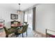Bright dining area features a round wood table with seating for four, with natural light at 27306 Deep Creek Blvd, Punta Gorda, FL 33983