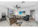 Comfortable living room features a cozy sectional sofa, recliner, and large screen TV for relaxing entertainment at 27306 Deep Creek Blvd, Punta Gorda, FL 33983