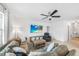 Comfortable living room features a cozy sectional sofa, recliner, and large screen TV for relaxing entertainment at 27306 Deep Creek Blvd, Punta Gorda, FL 33983