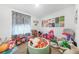 Colorful playroom is filled with toys, play structures, and vibrant wall art at 27306 Deep Creek Blvd, Punta Gorda, FL 33983