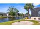 Expansive backyard with canal access, private dock, and lush landscaping, perfect for outdoor living at 2911 Riverside Dr, Punta Gorda, FL 33950