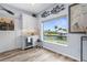 Charming bar area with custom cabinets, a wine cooler and a scenic outdoor view at 2911 Riverside Dr, Punta Gorda, FL 33950