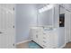 Bathroom featuring a vanity with a large mirror, modern fixtures, and tile floors at 2911 Riverside Dr, Punta Gorda, FL 33950