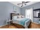 Charming bedroom with natural light, coastal decor, and a comfortable bed with coordinated bedding at 2911 Riverside Dr, Punta Gorda, FL 33950