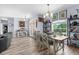 Bright dining room features a decorative chandelier, wood floors, and glass french doors leading outside at 2911 Riverside Dr, Punta Gorda, FL 33950