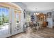 Inviting dining room with hardwood floors, chandelier, and a door to the front porch at 2911 Riverside Dr, Punta Gorda, FL 33950