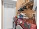 Laundry room with modern washer and dryer, shelving and utility door at 2911 Riverside Dr, Punta Gorda, FL 33950