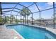 Relaxing screened pool with crystal clear water and canal views, ideal for enjoying sunny days at 2911 Riverside Dr, Punta Gorda, FL 33950