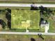 Aerial view of a property highlighting lot lines, surrounding roads and nearby home at 30154 Beech Rd, Punta Gorda, FL 33982