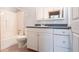 Clean bathroom featuring a vanity with storage, a toilet, and a shower-tub combination, designed for comfort at 30154 Beech Rd, Punta Gorda, FL 33982