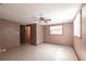 Cozy bedroom features tile flooring, a ceiling fan, neutral paint, a window, and closet at 30154 Beech Rd, Punta Gorda, FL 33982