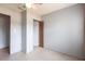Bedroom featuring neutral walls, tile flooring, and a louvered closet door, maximizing space efficiency at 30154 Beech Rd, Punta Gorda, FL 33982