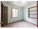 This bedroom has tile flooring, a ceiling fan, and natural light from a window at 30154 Beech Rd, Punta Gorda, FL 33982