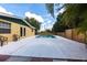 View of backyard pool surrounded by patio space and fenced perimeter at 30154 Beech Rd, Punta Gorda, FL 33982