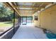 A screened porch with concrete flooring and a view of the pool at 30154 Beech Rd, Punta Gorda, FL 33982