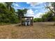 Exterior view of well house with lattice detail and tanks at 30154 Beech Rd, Punta Gorda, FL 33982
