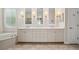 Bathroom featuring dual sinks, vanity, and bathtub at 3050 Rivershore Ln, Port Charlotte, FL 33953