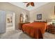 Bedroom with carpet, neutral decor, and ensuite bath at 3050 Rivershore Ln, Port Charlotte, FL 33953