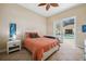 Relaxing bedroom featuring a view of the pool and outdoor area through sliding glass doors at 3050 Rivershore Ln, Port Charlotte, FL 33953
