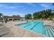 Inviting community pool with lap lanes, lounge chairs, and well-maintained landscaping at 3050 Rivershore Ln, Port Charlotte, FL 33953