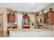 Spacious kitchen featuring granite countertops, stainless steel appliances, and wood cabinetry at 3050 Rivershore Ln, Port Charlotte, FL 33953