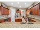 Beautiful kitchen featuring granite countertops, a center island, and stainless appliances at 3050 Rivershore Ln, Port Charlotte, FL 33953