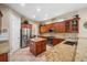 Spacious kitchen showcasing custom cabinets, stainless steel appliances, and a convenient center island at 3050 Rivershore Ln, Port Charlotte, FL 33953