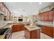 Gourmet kitchen featuring granite countertops, stainless steel appliances, and a center island at 3050 Rivershore Ln, Port Charlotte, FL 33953