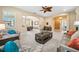Cozy living area with comfortable seating, elegant decor, and a seamless transition to the dining room at 3050 Rivershore Ln, Port Charlotte, FL 33953