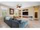 Inviting living room with ample seating, custom built-ins, and abundant natural light at 3050 Rivershore Ln, Port Charlotte, FL 33953