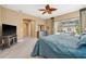 Comfortable main bedroom with carpet, neutral decor, walk-in closet, and dresser at 3050 Rivershore Ln, Port Charlotte, FL 33953