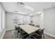 Bright meeting room with large windows and a neutral color palette featuring a large meeting table and comfortable seating at 3050 Rivershore Ln, Port Charlotte, FL 33953