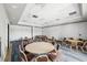 Meeting room with round tables, comfortable seating, and neutral decor, perfect for group gatherings at 3050 Rivershore Ln, Port Charlotte, FL 33953