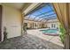 A beautiful screened-in pool and spa with brick pavers and ample lounge space offer the perfect backyard retreat at 3050 Rivershore Ln, Port Charlotte, FL 33953