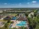 Overhead view showcasing the community's pool, clubhouse, and surrounding residential area with beautiful views at 3412 Grand Vista Ct # 202, Port Charlotte, FL 33953
