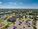 Community with amenities including tennis, bocce ball, pool, and clubhouse, amidst beautifully landscaped grounds at 3412 Grand Vista Ct # 202, Port Charlotte, FL 33953