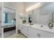 Bathroom with double sinks and large mirror with access to bedroom at 3412 Grand Vista Ct # 202, Port Charlotte, FL 33953