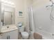 Bathroom featuring a shower and tub combo and sink with white cabinets at 3412 Grand Vista Ct # 202, Port Charlotte, FL 33953
